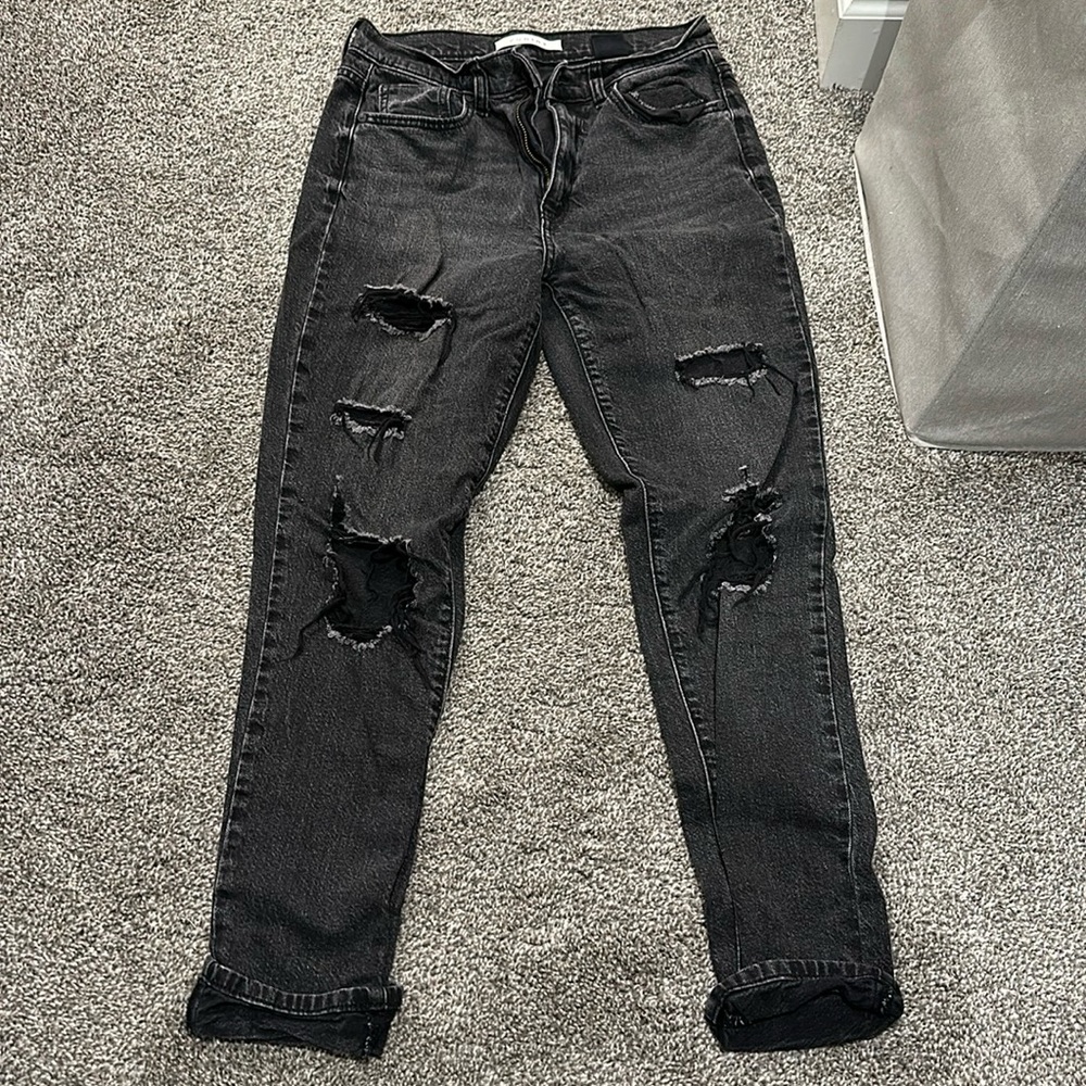 Super high rise Black distressed denim.